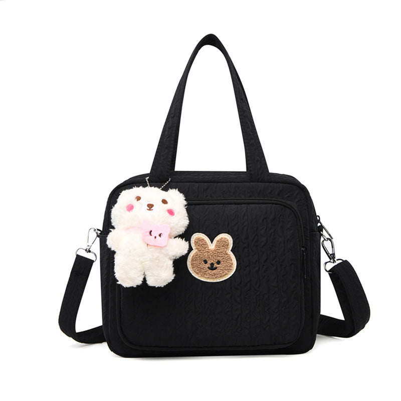 sac-pour-bebe-avec-pendentif-couleur-noire