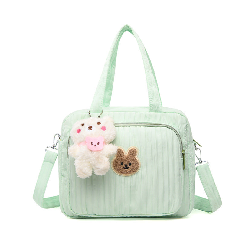 sac-pour-bebe-avec-pendentif-couleur-verte